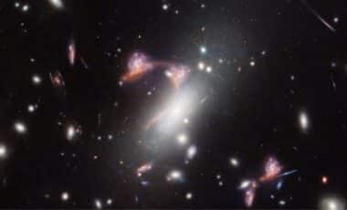 James Webb Captures A Cosmic Question Mark Formed By Distant Galaxies